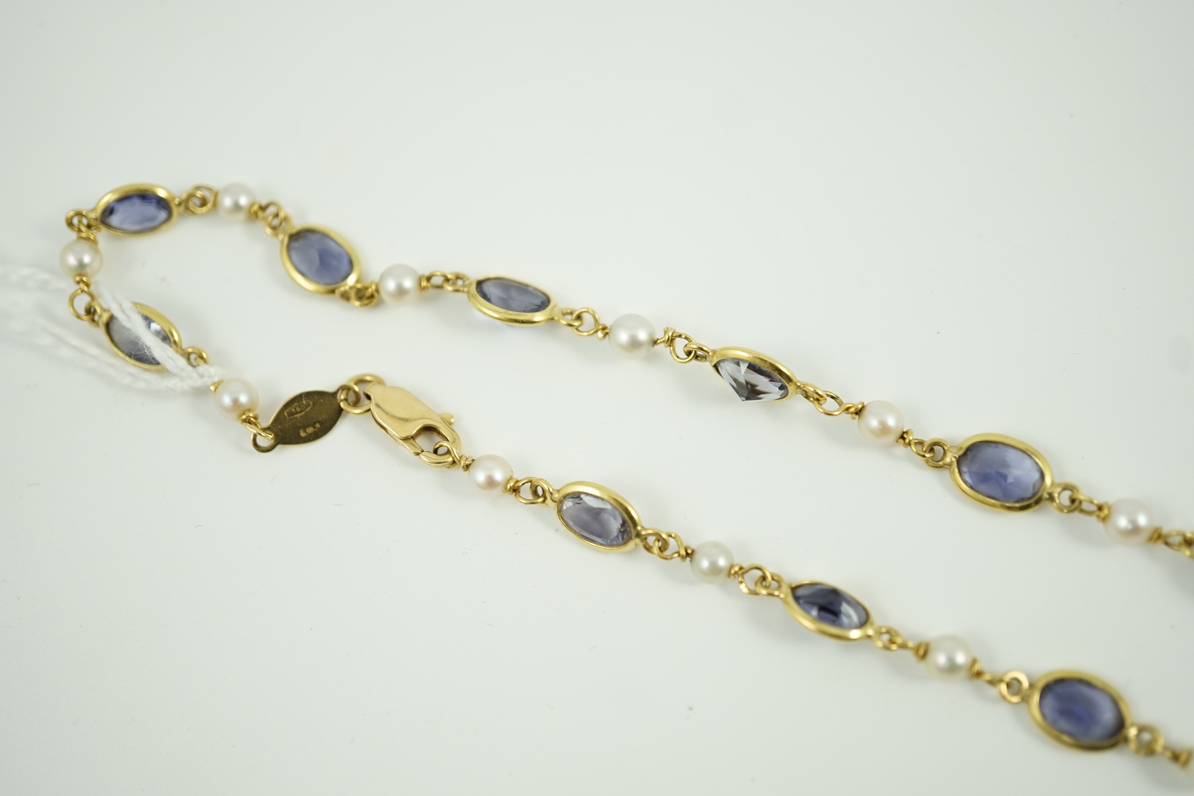 A modern 18ct gold, blue quartz and cultured pearl set spectacle necklace, 58cm, gross weight 15 grams.